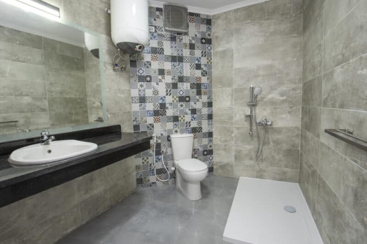 Interior Design Of A Luxury Show Home Bathroom With Disabled Access Shower Wet Room And Sink